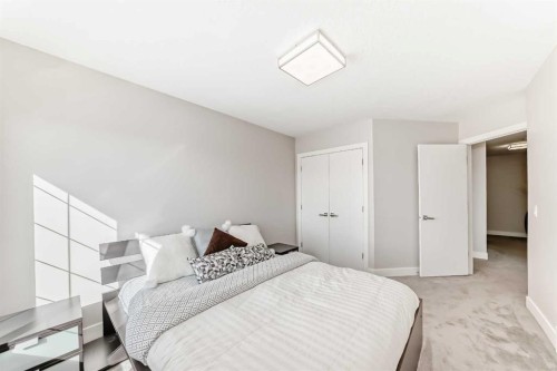 213 Springbluff Boulevard Sw, Calgary, AB - Indoor Photo Showing Bedroom