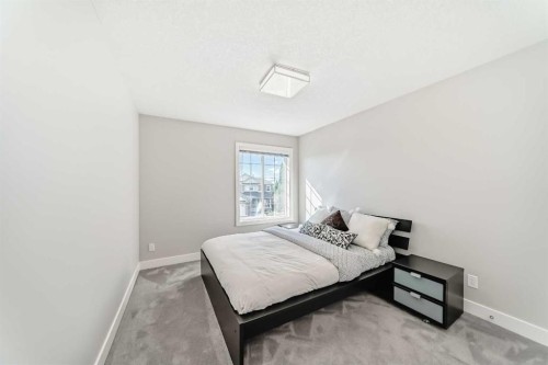 213 Springbluff Boulevard Sw, Calgary, AB - Indoor Photo Showing Bedroom