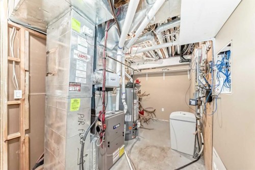 213 Springbluff Boulevard Sw, Calgary, AB - Indoor Photo Showing Laundry Room