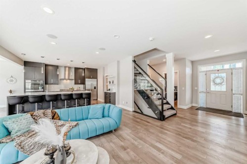 213 Springbluff Boulevard Sw, Calgary, AB - Indoor Photo Showing Living Room