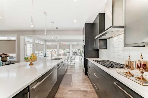 213 Springbluff Boulevard Sw, Calgary, AB - Indoor Photo Showing Kitchen With Upgraded Kitchen