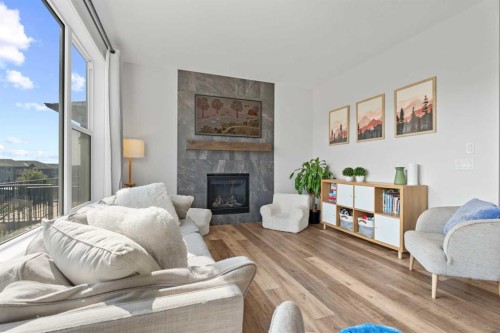 57 Ranchers Way, Okotoks, AB - Indoor Photo Showing Living Room With Fireplace