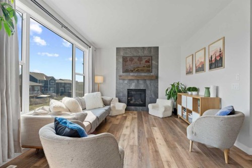 57 Ranchers Way, Okotoks, AB - Indoor Photo Showing Living Room With Fireplace