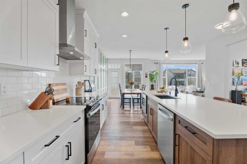 57 Ranchers Way, Okotoks, AB - Indoor Photo Showing Kitchen With Upgraded Kitchen
