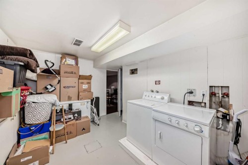 554 Whitehill Place Ne, Calgary, AB - Indoor Photo Showing Laundry Room