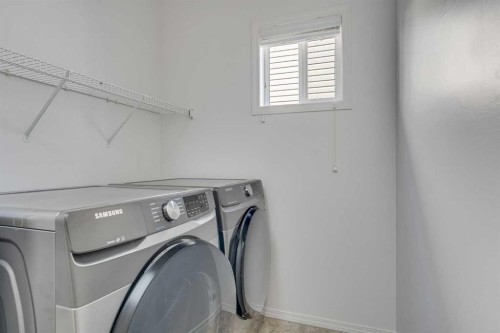 201 Crystalridge Rise, Okotoks, AB - Indoor Photo Showing Laundry Room