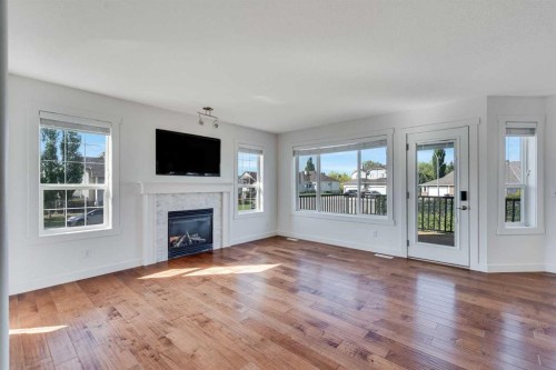 201 Crystalridge Rise, Okotoks, AB - Indoor Photo Showing Living Room With Fireplace