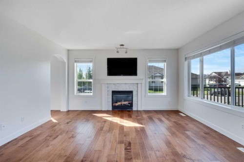 201 Crystalridge Rise, Okotoks, AB - Indoor Photo Showing Living Room With Fireplace