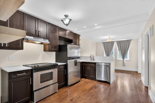 722 20 Avenue Nw, Calgary, AB - Indoor Photo Showing Kitchen With Stainless Steel Kitchen