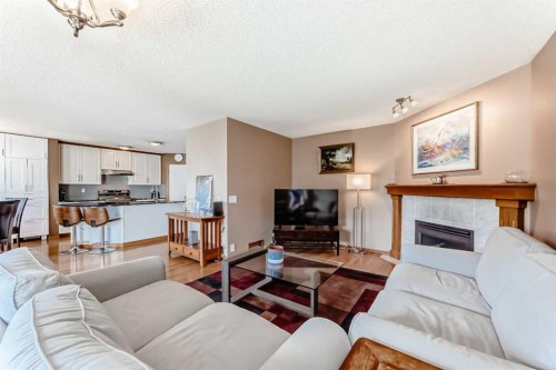 170 Shawbrooke Green Sw, Calgary, AB - Indoor Photo Showing Living Room With Fireplace
