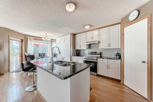 170 Shawbrooke Green Sw, Calgary, AB - Indoor Photo Showing Kitchen With Double Sink