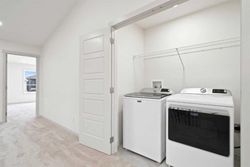 31 Lucas Passage Nw, Calgary, AB - Indoor Photo Showing Laundry Room