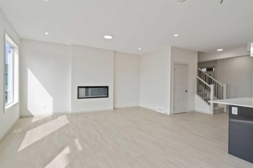 31 Lucas Passage Nw, Calgary, AB - Indoor With Fireplace
