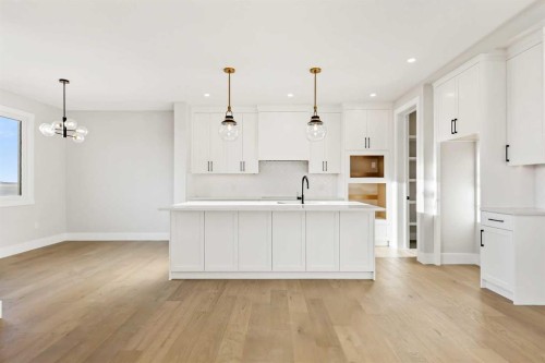 72 Heritage Ridge, Cochrane, AB - Indoor Photo Showing Kitchen With Upgraded Kitchen