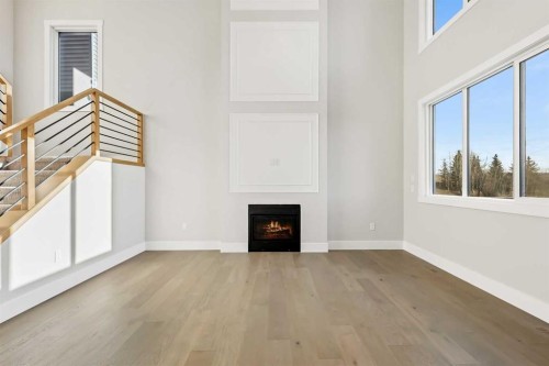 72 Heritage Ridge, Cochrane, AB - Indoor With Fireplace