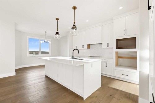 72 Heritage Ridge, Cochrane, AB - Indoor Photo Showing Kitchen With Upgraded Kitchen