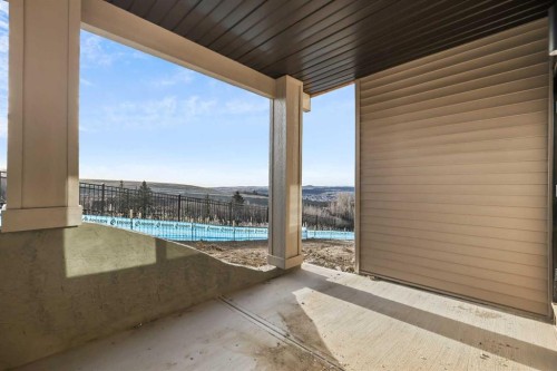 72 Heritage Ridge, Cochrane, AB - Outdoor With In Ground Pool With Exterior