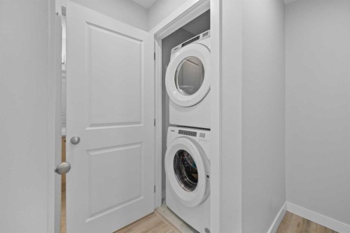 384 Canals Crossing Sw, Airdrie, AB - Indoor Photo Showing Laundry Room