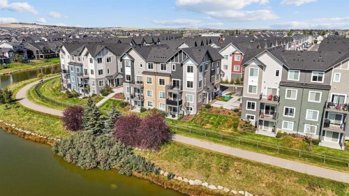 384 Canals Crossing Sw, Airdrie, AB - Outdoor With Body Of Water With Facade