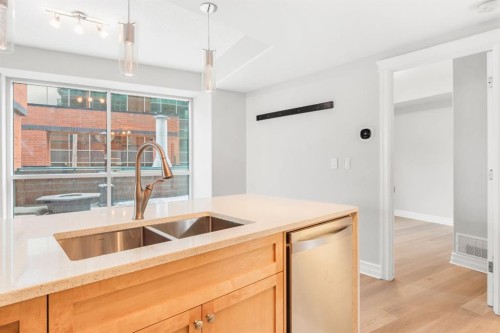 205-836 15 Avenue Sw, Calgary, AB - Indoor Photo Showing Kitchen With Double Sink