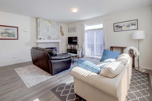 113 South Point Court Sw, Airdrie, AB - Indoor Photo Showing Living Room With Fireplace