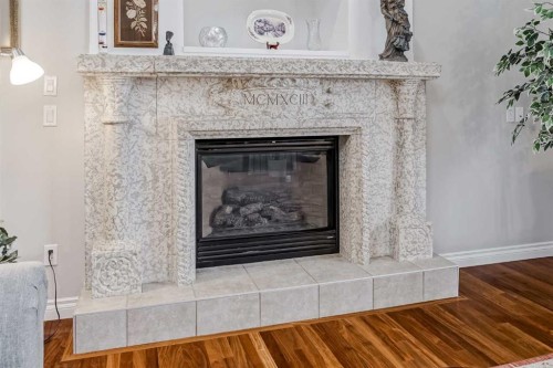 47 Rockywood Circle Nw, Calgary, AB - Indoor Photo Showing Living Room With Fireplace