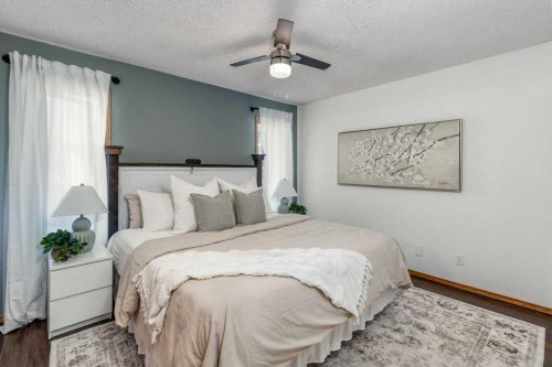 21 West Mcdougal Road, Cochrane, AB - Indoor Photo Showing Bedroom