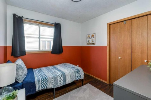 21 West Mcdougal Road, Cochrane, AB - Indoor Photo Showing Bedroom
