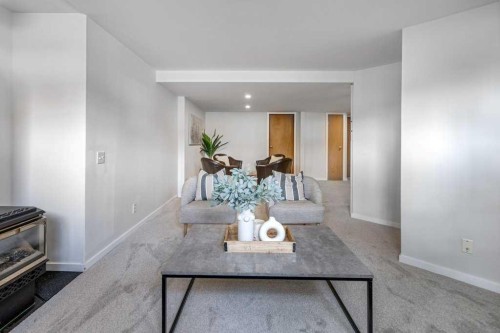 21 West Mcdougal Road, Cochrane, AB - Indoor Photo Showing Living Room With Fireplace