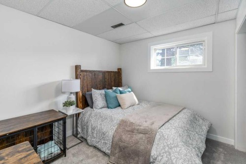 21 West Mcdougal Road, Cochrane, AB - Indoor Photo Showing Bedroom