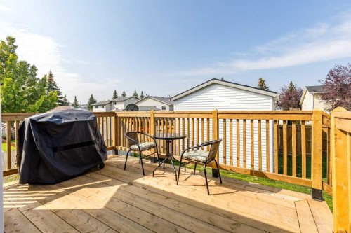21 West Mcdougal Road, Cochrane, AB - Outdoor With Deck Patio Veranda With Exterior