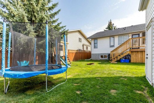 21 West Mcdougal Road, Cochrane, AB - Outdoor With Exterior