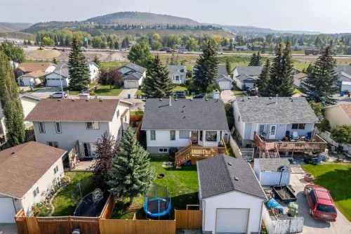 21 West Mcdougal Road, Cochrane, AB - Outdoor With Deck Patio Veranda