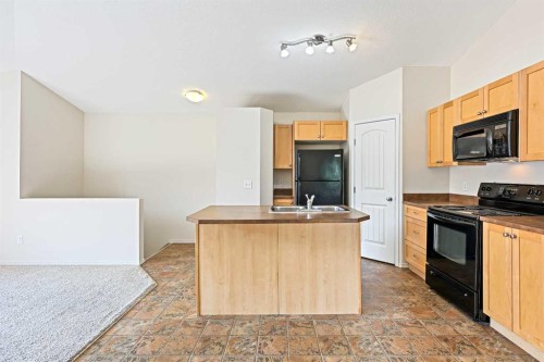 204-30 Panatella Landing Nw, Calgary, AB - Indoor Photo Showing Kitchen With Double Sink