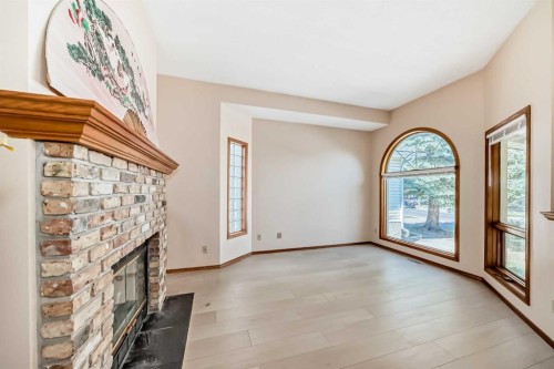 247 Shawinigan Drive Sw, Calgary, AB - Indoor Photo Showing Other Room With Fireplace
