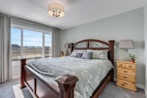 211 Willow Place, Cochrane, AB - Indoor Photo Showing Bedroom