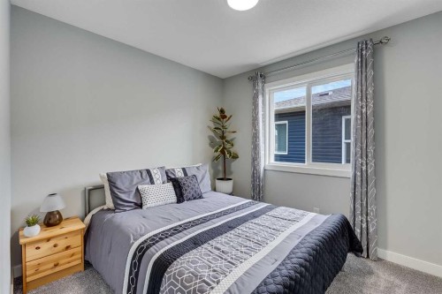 211 Willow Place, Cochrane, AB - Indoor Photo Showing Bedroom