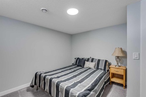 211 Willow Place, Cochrane, AB - Indoor Photo Showing Bedroom