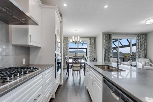 211 Willow Place, Cochrane, AB - Indoor Photo Showing Kitchen With Double Sink With Upgraded Kitchen