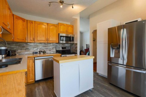 1118 Maple Avenue, Crossfield, AB - Indoor Photo Showing Kitchen With Double Sink