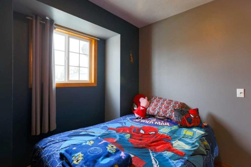 1118 Maple Avenue, Crossfield, AB - Indoor Photo Showing Bedroom
