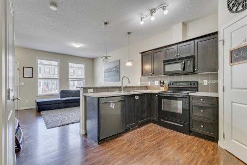 802-1001 8 Street Nw, Airdrie, AB - Indoor Photo Showing Kitchen