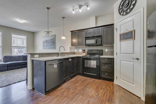 802-1001 8 Street Nw, Airdrie, AB - Indoor Photo Showing Kitchen