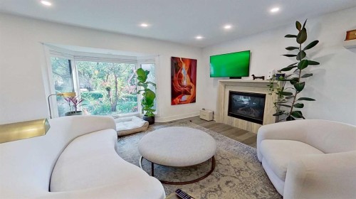 1423 18 Street Ne, Calgary, AB - Indoor Photo Showing Living Room With Fireplace