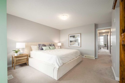 133 Cougar Ridge Close Sw, Calgary, AB - Indoor Photo Showing Bedroom