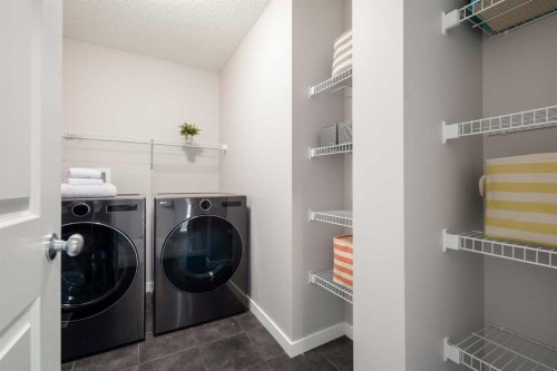 133 Cougar Ridge Close Sw, Calgary, AB - Indoor Photo Showing Laundry Room
