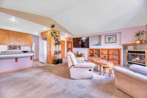 14 Grande Point Estates, Strathmore, AB - Indoor Photo Showing Living Room With Fireplace