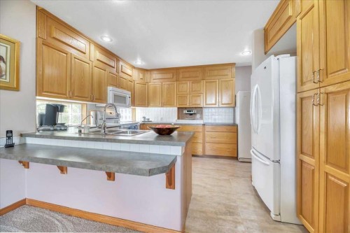 14 Grande Point Estates, Strathmore, AB - Indoor Photo Showing Kitchen With Double Sink