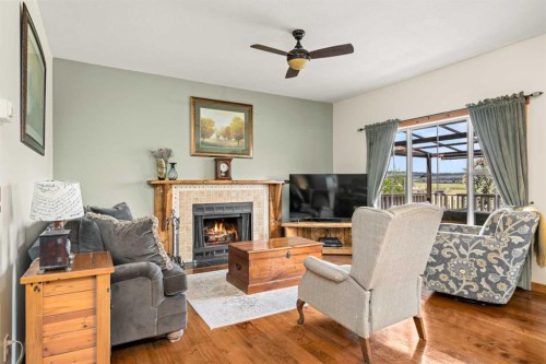 122 Hidden Creek Heights Nw, Calgary, AB - Indoor Photo Showing Living Room With Fireplace
