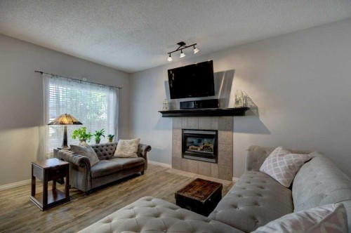 18380 Chaparral Street Se, Calgary, AB - Indoor Photo Showing Living Room With Fireplace